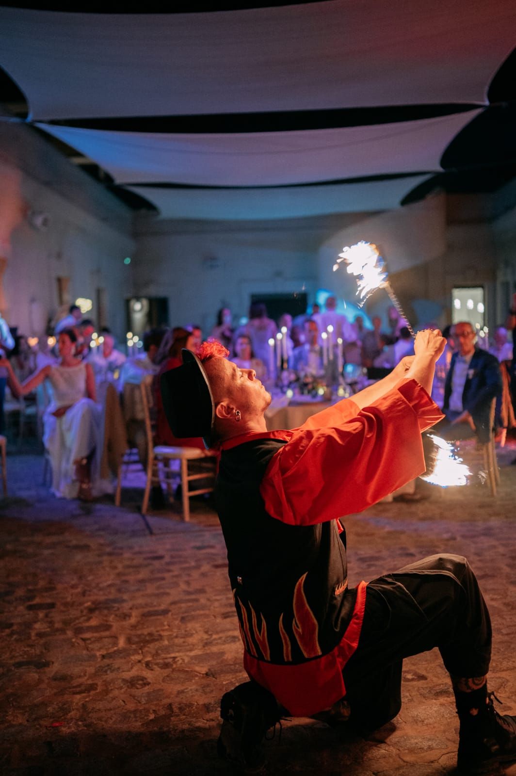 Fire performer entertaining wedding guests